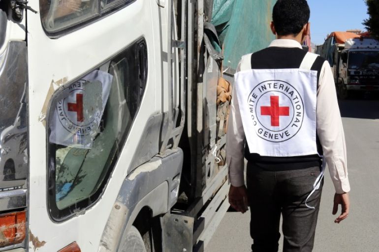 epa06791768 (FILE) - A member of staff from the International Committee of the Red Cross passes a truck carrying ICRC-provided emergency medical aid, in Sana’a, Yemen, 13 December 2017 (issued 07 June 2018). According to reports, the International Committee of the Red Cross (ICRC) has pulled 71 staff members out of Yemen amid rising insecurity in the war-torn Arab country. EPA-EFE/YAHYA ARHAB
