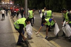 epa06783807 Jordanians clean the street during a demonstration against the newly proposed income tax reforms and hike in petrol tax in Amman, Jordan, 03 June 2018 (issued 04 June 2018). According to local media reports on 03 June, Jordan's Prime Minister Hani Al-Mulki is due to meet with King Abdullah II at the royal Palace on 04 June to discuss the situation. EPA-EFE/ANDRE PAIN
