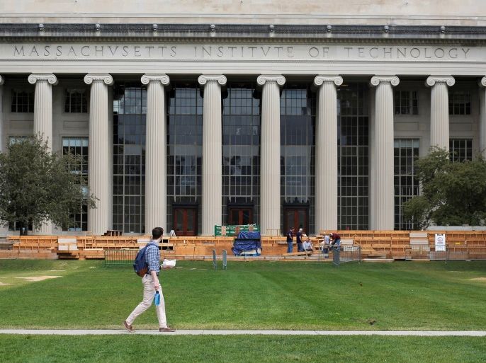 A man walks through Killian Court at the Massachusetts Institute of Technology (MIT) in Cambridge, Massachusetts, U.S. May 13, 2016. To match special report COLLEGE-CHARITY/ REUTERS/Brian Snyder/File Photo