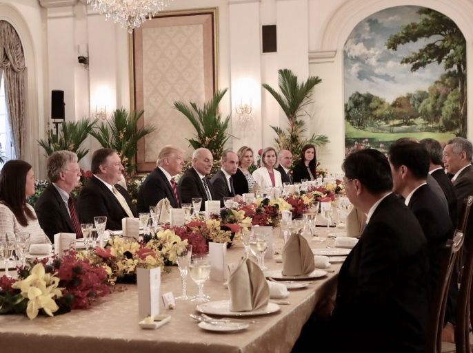 SINGAPORE, SINGAPORE - JUNE 11: In this handout provided by the Singapore's Ministry of Communications and Information (MCI) shows U.S. President Donald Trump (6th from Left), Michael Pompeo (5th from Right), John Bolton (4th from Right), Sarah Huckabee Sanders (3rd from Right), with Singapore's Prime Minister Lee Hsien Loong (R) on June 11, 2018 in Singapore, Singapore. The historic meeting between U.S. President Donald Trump and North Korean leader Kim Jong-un has been scheduled in Singapore for June 12 as the world awaits the landmark summit in the Southeast Asian city-state. (Photo by Singapore's Ministry of Communications and Information (MCI)/via Getty Images)