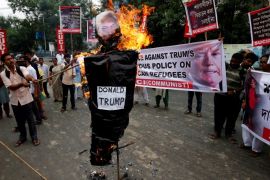 Activists from the Socialist Unity Centre of India (SUCI) burn an effigy depicting U.S. President Donald Trump during a protest against the Trump administration's immigration policy that results in the separation of children from their parents at the southern border of the U.S., in Kolkata, India, June 23, 2018. REUTERS/Rupak De Chowdhuri