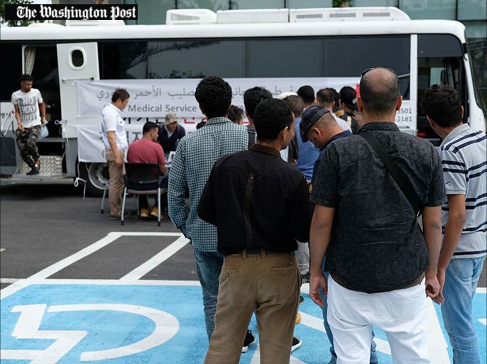 Yemeni refugees line up for a free health screening by the Korean Red Cross on Jeju Island on June 19. (Min Joo Kim/The Washington Post)