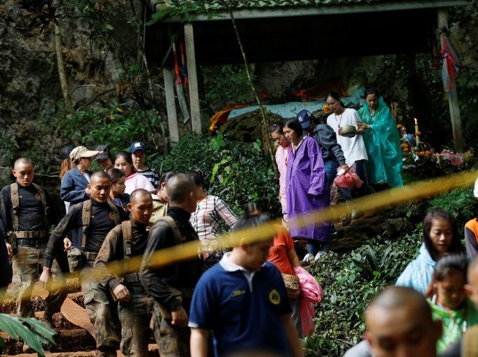Family members and soldiers are seen near the Tham Luang cave complex during a search for members of an under-16 soccer team and their coach, in the northern province of Chiang Rai, Thailand, June 27, 2018. REUTERS/Soe Zeya Tun