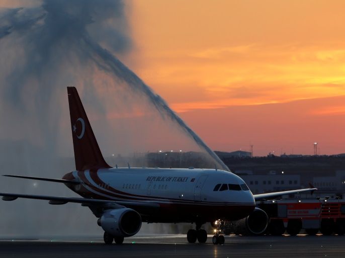 An airplane carrying Turkey's President Tayyip Erdogan receives water salute after landing to the Istanbul's third international airport which is still under construction during a ceremony marking the first landing, Turkey, June 21, 2018. REUTERS/Umit Bektas