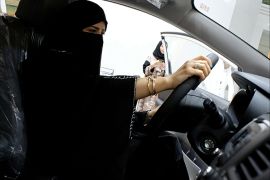 FILE PHOTO: A Saudi woman checks a car at the first automotive showroom solely dedicated for women in Jeddah, Saudi Arabia, Jan. 11, 2018. REUTERS/Reem Baeshen//File Photo