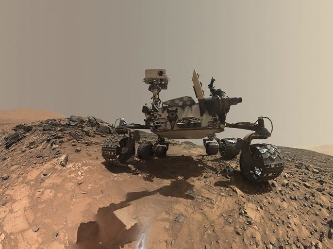 NASA's Curiosity Mars rover is seen at the site from which it reached down to drill into a rock target called 'Buckskin' on lower Mount Sharp in this low-angle self-portrait taken August 5, 2015 and released August 19, 2015. The selfie combines several component images taken by Curiosity's Mars Hand Lens Imager (MAHLI) during the 1,065th Martian day, or sol, of the rover's work on Mars, according to a NASA news release. REUTERS/NASA/JPL-Caltech/MSSS/Handout THIS
