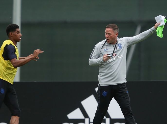Soccer Football - World Cup - England Training - Saint Petersburg, Russia - June 19, 2018 England assistant manager Steve Holland and Marcus Rashford during training REUTERS/Lee Smith