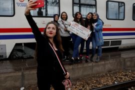 Sibel Uysal, 20, poses for a selfie with her friends before the Eastern Express departs from Ankara province en route from Ankara to Kars, Turkey, April 9, 2018. REUTERS/Umit Bektas SEARCH