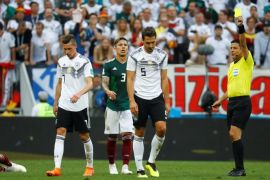 Soccer Football - World Cup - Group F - Germany vs Mexico - Luzhniki Stadium, Moscow, Russia - June 17, 2018 Germany's Mats Hummels is shown a yellow card by referee Alireza Faghani REUTERS/Kai Pfaffenbach