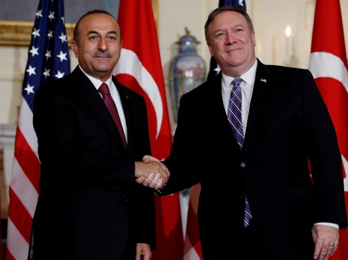 U.S. Secretary of State Mike Pompeo shakes hands with Turkish Foreign Minister Mevlut Cavusoglu at the State Department in Washington, U.S., June 4, 2018. REUTERS/Leah Millis