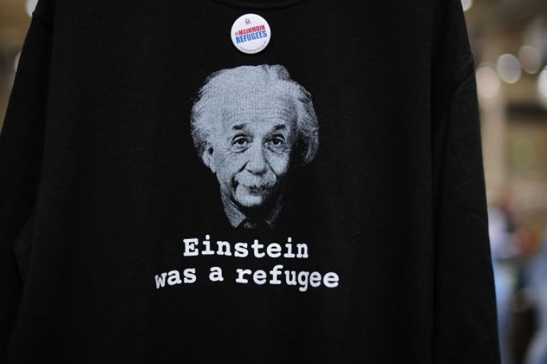 HAMBURG, GERMANY - OCTOBER 29: A shirt of Albert Einstein is seen at a huge donations center for migrants and refugees at the Messe trade fair grounds on October 29, 2015 in Hamburg, Germany. The center was launched in early September as the influx of migrants in Germany spiked and since then the center has moved into an even bigger hall at the trade fair grounds. Germany is struggling to accommodate what it expects will be at least one million asylum applicants this year and tens of thousands of volunteers are doing what they can across the country to help. (Photo by Alexander Koerner/Getty Images)