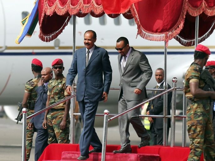 Eritrea's President Isaias Afwerki is welcomed by Ethiopian Prime Minister Abiy Ahmed upon arriving for a three-day visit, at the Bole international airport in Addis Ababa, Ethiopia July 14, 2018. REUTERS/Tiksa Negeri