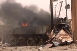 A still image taken from a video shows an armoured personnel carrier on fire after a car bomb attack in Gao, northern Mali July 1, 2018. REUTERS/via Reuters TV