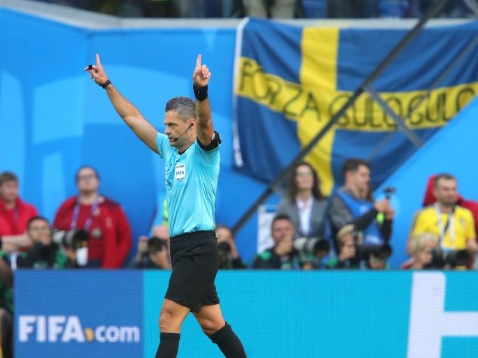 SAINT PETERSBURG, RUSSIA - JULY 03: Referee Damir Skomina announces a VAR review during the 2018 FIFA World Cup Russia Round of 16 match between Sweden and Switzerland at Saint Petersburg Stadium on July 3, 2018 in Saint Petersburg, Russia. (Photo by Alexander Hassenstein/Getty Images)