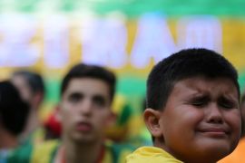 Soccer Football - World Cup - Quarter Final - Brazil vs Belgium - Rio de Janeiro, Brazil - July 6, 2018 - A boy reacts after the match. REUTERS/Sergio Moraes
