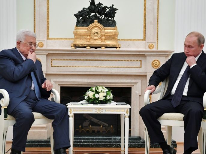 Russian President Vladimir Putin (R) meets with Palestinian President Mahmoud Abbas at the Kremlin in Moscow, Russia July 14, 2018. Pool/Yuri Kadobnov via REUTERS