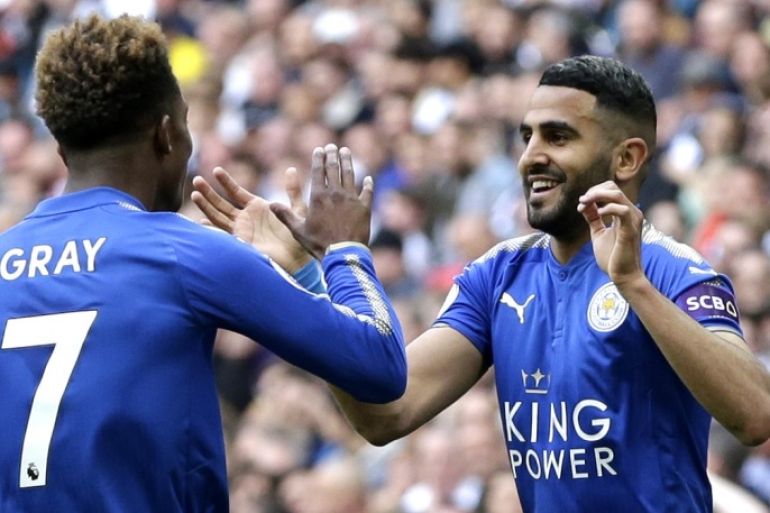 LONDON, ENGLAND - MAY 13: Riyad Mahrez of Leicester City celebrates scoring his sides second goal with team mate Demarai Gray of Leicester City during the Premier League match between Tottenham Hotspur and Leicester City at Wembley Stadium on May 13, 2018 in London, England. (Photo by Henry Browne/Getty Images)