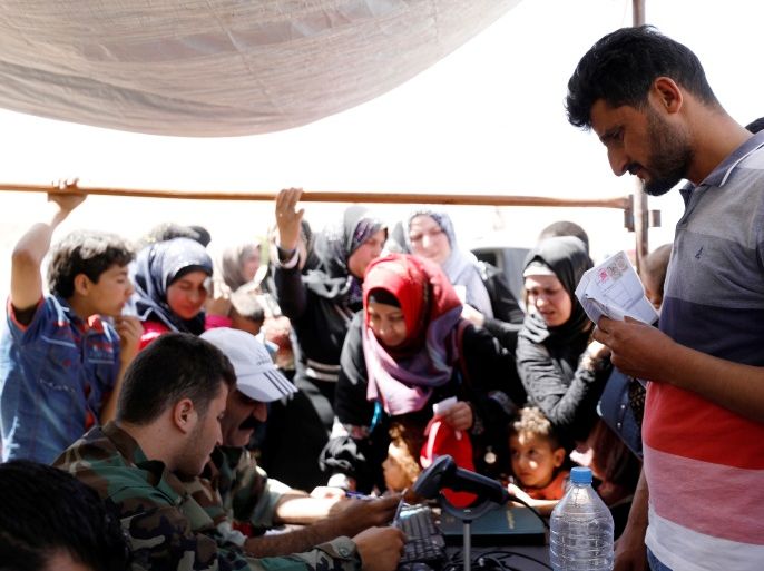 Syrian refugee Ali Abdullah, 34, who left Lebanon arrives in Qalamoun, Syria June 28, 2018. REUTERS/Omar Sanadiki