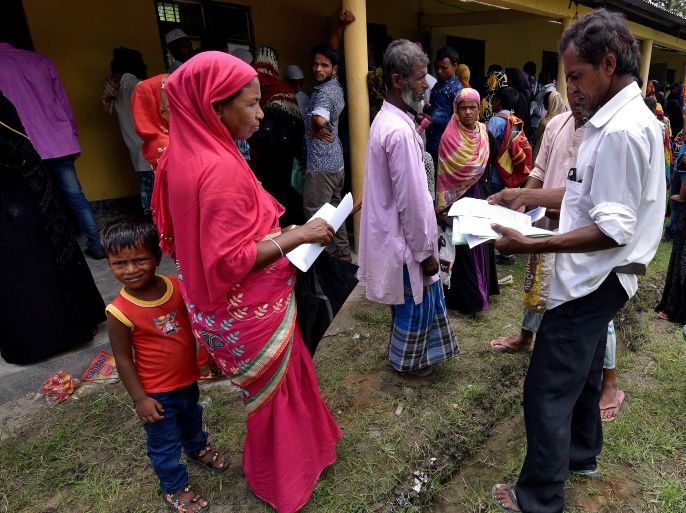 Villagers wait outside the National Register of Citizens (NRC) centre to get their documents verified by government officials, at Mayong Village in Morigaon district, in the northeastern state of Assam, India July 8, 2018. Picture taken July 8, 2018. REUTERS/Stringer