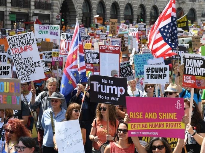 epa06885800 Tens of thousands of people take part in a Stop Trump Coalition - Stop the War Protest against the US President Donal J. Trump visit in London, Britain, 13 July 2018. Trump is on a working visit to Britain. EPA-EFE/ANDY RAIN