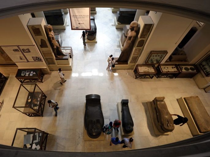 Tourists look at artefacts inside the Egyptian Museum in Cairo, Egypt July 4, 2018. REUTERS/Mohamed Abd El Ghany