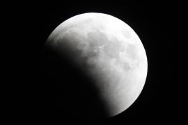 epa06914707 The moon is partially covered during a lunar eclipse in Jerusalem, Israel, 27 July 2018. The lunar eclipse on the night of 27 July 2018 will be the longest total lunar eclipse of the 21st century with the event spanning for over four hours, and the total eclipse phase lasting for 103 minutes. EPA-EFE/ABIR SULTAN black and white