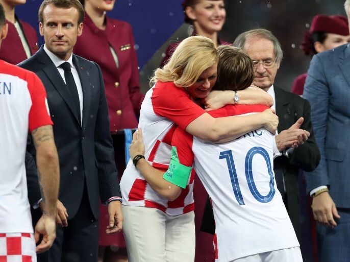 MOSCOW, RUSSIA - JULY 15: President of Croatia, Kolinda Grabar Kitarovic greets Luka Modric of Croatia as he is presented with his runners-up medal after the 2018 FIFA World Cup Final between France and Croatia at Luzhniki Stadium on July 15, 2018 in Moscow, Russia. (Photo by Clive Rose/Getty Images)