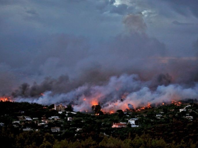 A wildfire rages in the town of Rafina, near Athens, Greece, July 23, 2018. REUTERS/Alkis Konstantinidis TPX IMAGES OF THE DAY