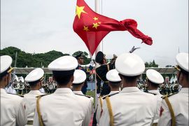 epa06083053 (FILE) - People's Liberation Army (PLA) soldiers participate in a flag raising ceremony during an open day at the PLA navy base in Hong Kong, China, 08 July 2017 (reissued 12 July 2017). According to reports, China ships carrying military personnel departed on 11 July 2017 from Zhanjiang, southern China and set sails to Djibouti. China is to establish it's fiorst ever overseas military base in the Djibouti, at the Horn of Africa. EPA/JEROME FAVRE