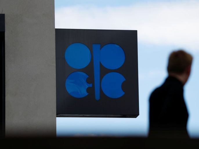 A person passes the logo of the Organization of the Petroleoum Exporting Countries (OPEC) in front of OPEC's headquarters in Vienna, Austria June 19, 2018. REUTERS/Leonhard Foeger