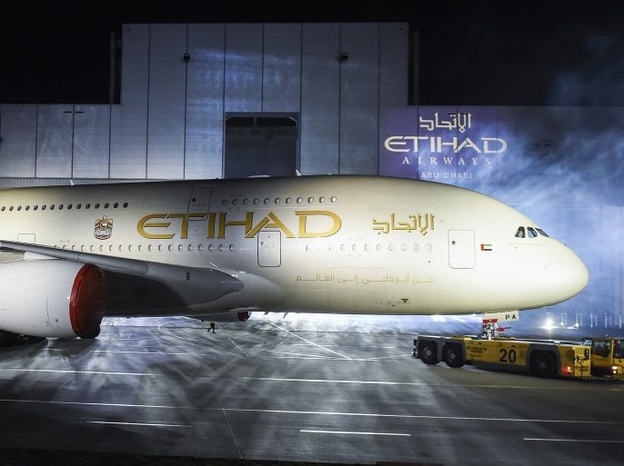 An Airbus A380-800 rolls out of a paint hangar during a branding ceremony of Etihad Airways, the national airline of the United Arab Emirates (UAE), at the German headquarters of aircraft company Airbus, in Hamburg-Finkenwerder September 25, 2014. Abu Dhabi's state-owned Etihad Airways showed off its first A380 super jumbo and unveiled its new branding on Thursday as it seeks to up the battle in the luxury stakes and continue its rapid growth. REUTERS/Fabian Bimmer (