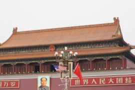 BEIJING, CHINA - NOVEMBER 09: China and US flag is displayed in front of the portrait of China's late communist leader Mao Zedong outside the Forbidden City on November 9, 2017 in Beijing, China. At the invitation of Chineses President Xi Jinping, U.S President Donald Trump is to pay a state visit to China from November 8 to 10. (Photo by Lintao Zhang/Getty Images)