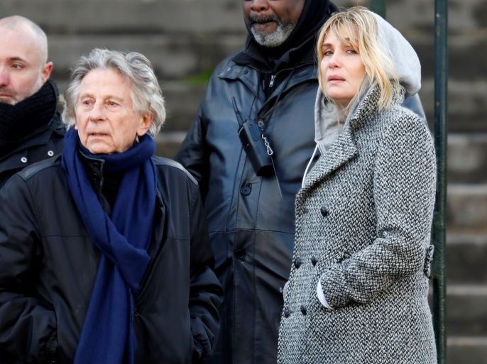 Film director Roman Polanski and Emmanuelle Seigner arrive at the Madeleine Church to attend a ceremony during a 'popular tribute' to late French singer and actor Johnny Hallyday in Paris, France, December 9, 2017. REUTERS/Charles Platiau