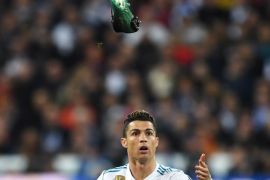 MADRID, SPAIN - APRIL 11: Cristiano Ronaldo of Real Madrid reacts as his boot flies through the air during the UEFA Champions League Quarter Final Second Leg match between Real Madrid and Juventus at Estadio Santiago Bernabeu on April 11, 2018 in Madrid, Spain. (Photo by David Ramos/Getty Images)