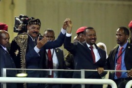 Eritrea's President Isaias Afwerki and Ethiopian Prime Minister Abiy Ahmed hold hands during a concert at the Millennium Hall in Addis Ababa, Ethiopia July 15, 2018. REUTERS/Tiksa Negeri