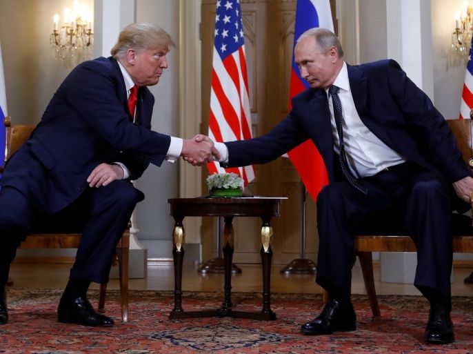 U.S. President Donald Trump and Russia's President Vladimir Putin shake hands as they meet in Helsinki, Finland July 16, 2018. REUTERS/Kevin Lamarque TPX IMAGES OF THE DAY