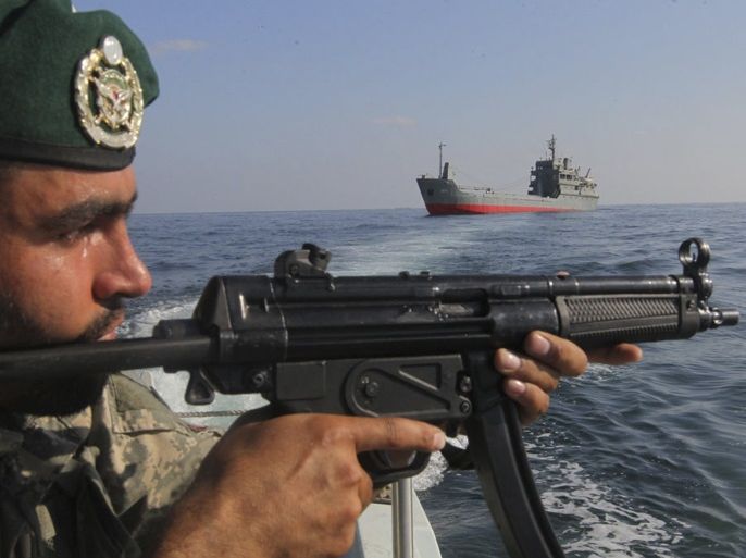 EDITORS' NOTE: Reuters and other foreign media are subject to Iranian restrictions on their ability to film or take pictures in Tehran.A military personnel participates in the Velayat-90 war game on Sea of Oman near the Strait of Hormuz in southern Iran December 28, 2011.