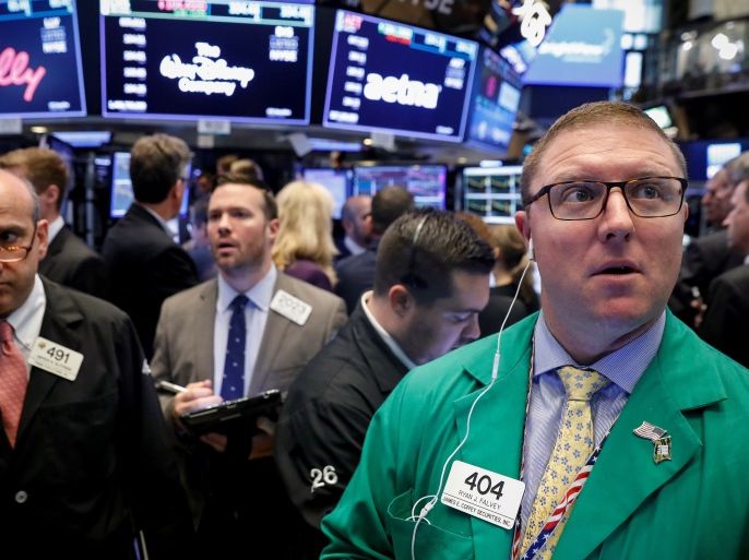 Traders work on the floor of the New York Stock Exchange (NYSE) in New York, U.S., June 28, 2018. REUTERS/Brendan McDermid
