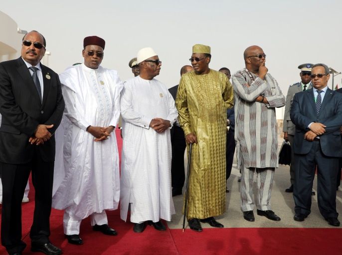 From L, Mauritania's President Mohamed Ould Abdel Aziz, Niger's President Mahamadou Issoufou, Mali's President Ibrahim Boubacar Keita, Chad's President Idriss Deby, Burkina Faso's President Roch Marc Christian Kabore pose before a working session at the G5 Defence Academy in Nouakchott, Mauritania, July 2, 2018. Ludovic Marin/Pool via Reuters