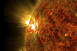 An active region on the sun emitting a mid-level solar flare, peaking at 04:47EST (09:47GMT) is seen in an image was captured by NASA's Solar Dynamics Observatory (SDO) November 5, 2014. This is the second mid-level flare from the same active region, labeled AR 12205, which rotated over the left limb of the sun on November 3. REUTERS/NASA/SDO/Handout via Reuters (OUTER SPACE - Tags: SCIENCE TECHNOLOGY) THIS IMAGE HAS BEEN SUPPLIED BY A THIRD PARTY. IT IS DISTRIBUTED, EXACTLY AS RECEIVED BY REUTERS, AS A SERVICE TO CLIENTS. FOR EDITORIAL USE ONLY. NOT FOR SALE FOR MARKETING OR ADVERTISING CAMPAIGNS