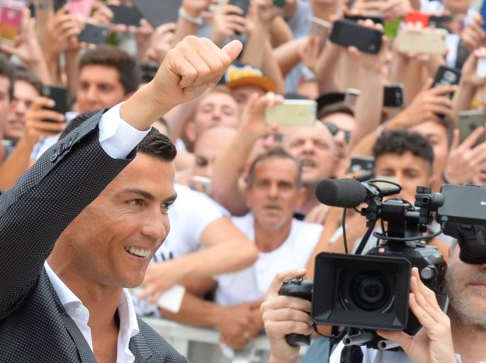 Cristiano Ronaldo gestures as he arrives at the Juventus' medical center in Turin, Italy July 16, 2018. REUTERS/Massimo Pinca