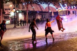 PARIS, FRANCE - JULY 15: Water canon is used as French football fans clash with police following celebrations on the Champs-Elysees after France's victory against Croatia in the World Cup Final on July 15, 2018 in Paris, France. France beat Croatia 4-2 in the World Cup Final played at Moscow's Luzhniki Stadium today. (Photo by Jack Taylor/Getty Images)