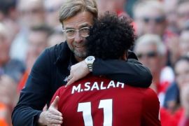 Soccer Football - Premier League - Liverpool vs Brighton & Hove Albion - Anfield, Liverpool, Britain - May 13, 2018 Liverpool's Mohamed Salah is hugged by manager Juergen Klopp as he is substituted Action Images via Reuters/Carl Recine EDITORIAL USE ONLY. No use with unauthorized audio, video, data, fixture lists, club/league logos or