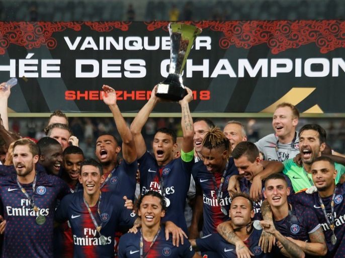 Soccer Football - French Super Cup Trophee des Champions - Paris St Germain v AS Monaco - Shenzhen Universiade Sports Centre, Shenzhen, China - August 4, 2018 Paris St Germain's Thiago Silva celebrates with the trophy and team mates after winning the French Super Cup REUTERS/Bobby Yip
