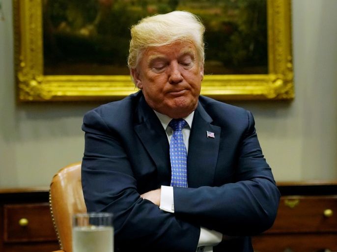 U.S. President Donald Trump reacts while holding a roundtable on the Foreign Investment Risk Review Modernization Act at the White House in Washington, U.S., August 23, 2018. REUTERS/Kevin Lamarque