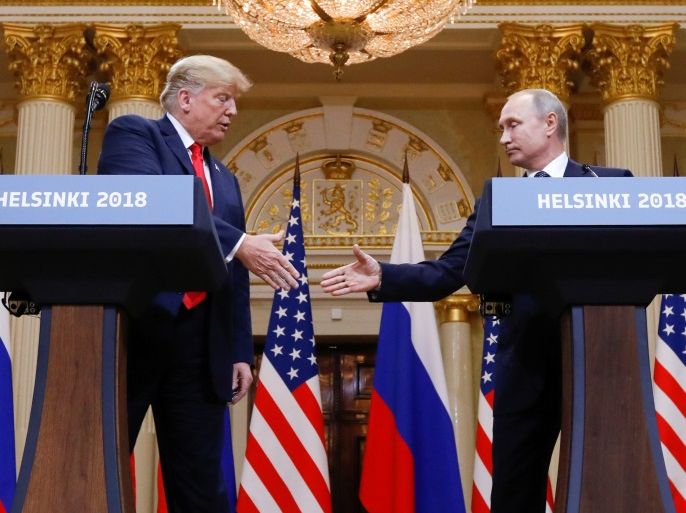 U.S. President Donald Trump and Russia's President Vladimir Putin shake hands during a joint news conference after their meeting in Helsinki, Finland, July 16, 2018. REUTERS/Kevin Lamarque
