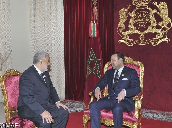 Secretary general of the Justice and Development Party (PJD), Abdelilah Benkirane (L), meets with Morocco's King Mohammed VI in Midelt November 29, 2011. King Mohammed VI named Benkirane as Prime Minister after his Islamist party's victory in the November 25 elections. Watermark from source. REUTERS/Maghreb arabe presse/Handout (MOROCCO - Tags: POLITICS ROYALS) THIS IMAGE HAS BEEN SUPPLIED BY A THIRD PARTY. IT IS DISTRIBUTED, EXACTLY AS RECEIVED BY REUTERS, AS A SERVI