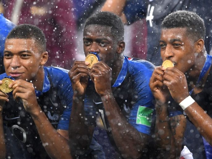 MOSCOW, RUSSIA - JULY 15: Kylian Mbappe, Ousmane Dembele and Presnel Kimpembe of France celebrate victory following the 2018 FIFA World Cup Final between France and Croatia at Luzhniki Stadium on July 15, 2018 in Moscow, Russia. (Photo by Laurence Griffiths/Getty Images)