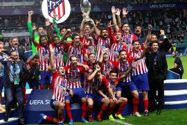 epa06951911 Players of Real Atletico celebrate with the trophy after winning 4-2 the UEFA Super Cup match Real Atletico vs Real Madrid at the Lillekula Stadium in Tallinn, Estonia, 15 August 2018. EPA-EFE/TOMS KALNINS