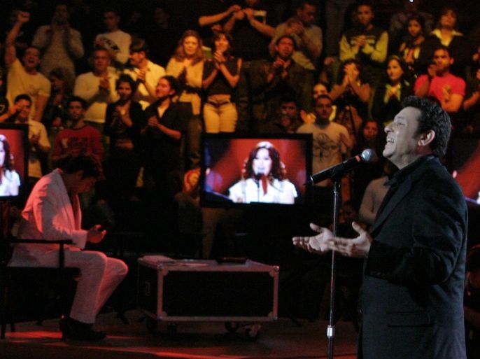 Tunisian singer Latifa(L) and Egyptian singer Hani Shaker perform during a program called